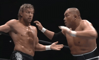 Two Men Wrestling, One In Dragon Shorts GIF