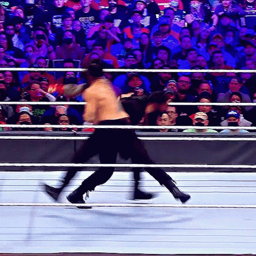 Two Men Wrestling, One In NBC Shirt GIF