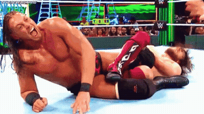 Two Men Wrestling, One In Red Knee Pads GIF