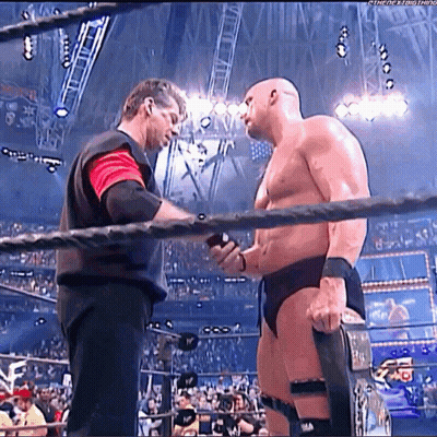 Two Men Wrestling Ring One Holding Belt GIF