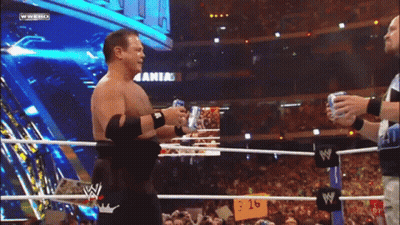 Two Men Wrestling With Arik Sign GIF