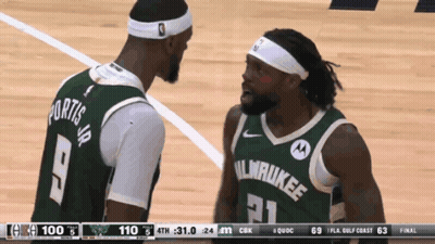 Two Milwaukee Basketball Players Are Talking On The Court GIF
