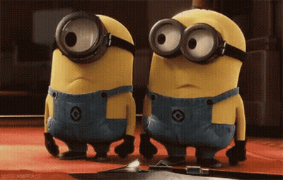 Two Minions In Goggles And Overalls On Red Carpet GIF