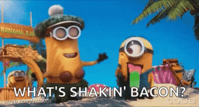 Two Minions On Beach Saying What's Shakin Bacon GIF