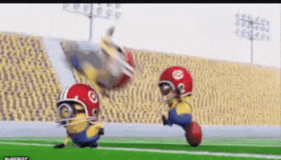 Two Minions Playing Football GIF