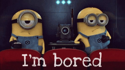 Two Minions Sitting In Red Seats Bored GIF