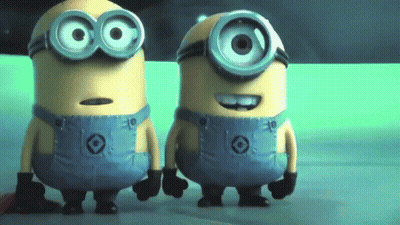 Two Minions Standing Next To Each Other GIF