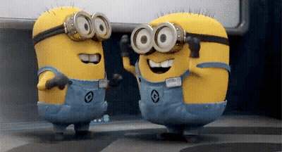 Two Minions Wearing Goggles Are Dancing Together GIF