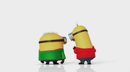 Two Minions Wearing Green And Red Sweaters Are Dancing Together GIF