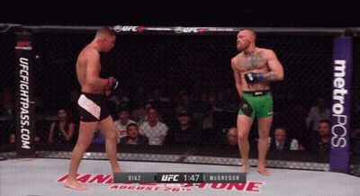 Two MMA Fighters In Cage GIF