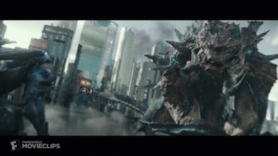 Two Monsters Are Fighting In A City In A Movie Clip . GIF