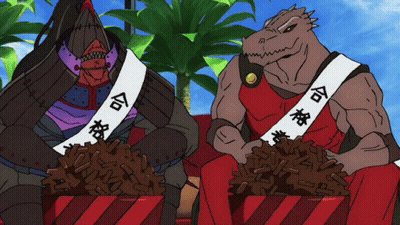 Two Monsters Are Sitting Next To Each Other With One Wearing A Sash That Says ' Com ' On It GIF