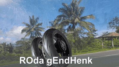 Two Motorcycle Tires On A Road With Roda Gendhenk Written In White GIF