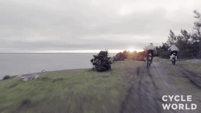 Two Motorcycles Riding Dirt Road GIF