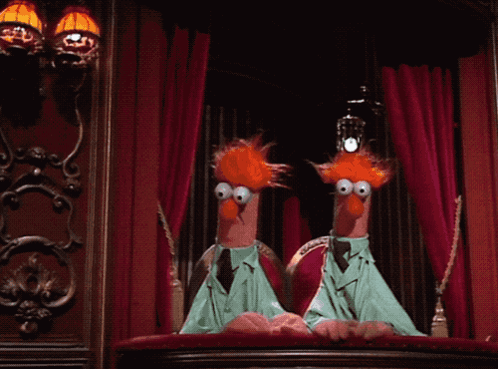Two Muppets Are Sitting On A Balcony With A Red Curtain In The Background GIF