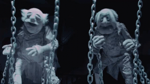 Two Muppets Chained Together One Laughing GIF