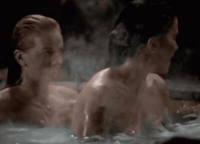 Two Naked Women Are Taking A Bath Together GIF