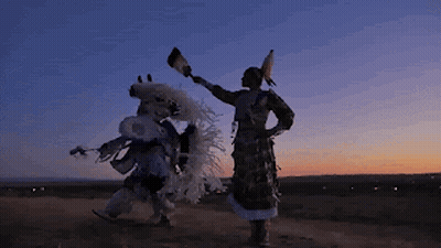 Two Native Americans Dancing At Sunset GIF