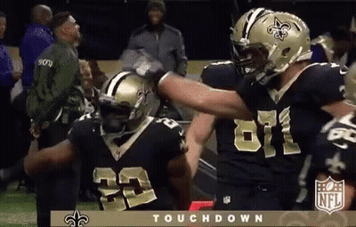 Two New Orleans Saints Players Hugging GIF