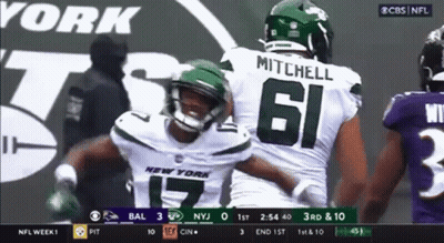 Two New York Jets Football Players Hugging On Field GIF