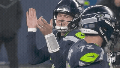 Two NFL Football Players High Fiving GIF