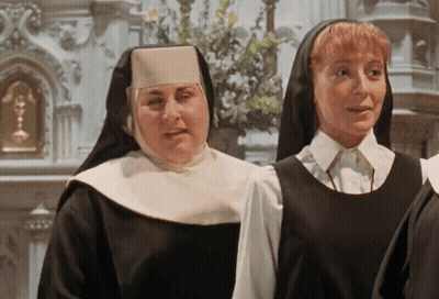 Two Nuns In Front Of Church GIF