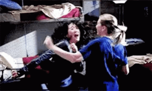 Two Nurses Are Fighting In A Room In A Hospital . GIF