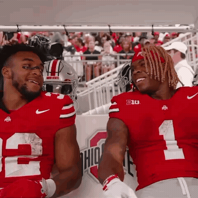 Two Ohio State Football Players Smiling On Sidelines GIF