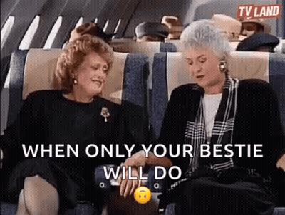 Two Older Women Holding Hands And Laughing On Plane GIF