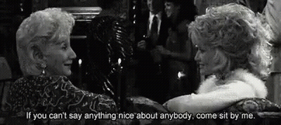 Two Older Women Sitting In Black And White Photo With Quote GIF