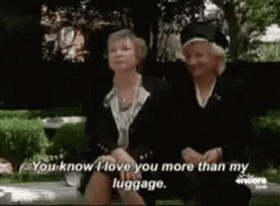 Two Older Women Sitting On Bench Saying I Love You More Than My Luggage GIF