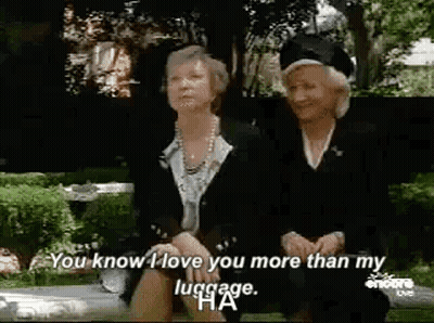 Two Older Women Sitting On Bench Talking GIF