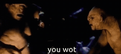 Two Orcs Are Standing Next To Each Other In A Dark Room With The Words `` You Wot '' Written In The Corner . GIF