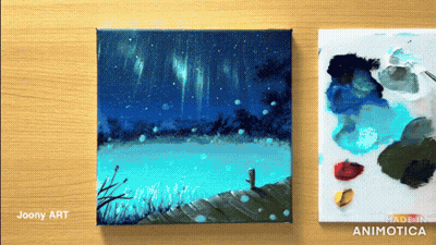 Two Paintings On Wooden Table By Joony Art And Made In Animatica GIF