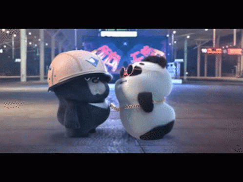 Two Panda Bears Are Standing Next To Each Other On A Street GIF