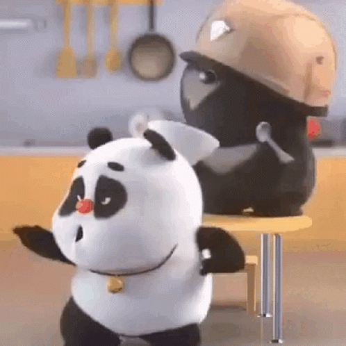 Two Panda Bears Are Standing Next To Each Other On A Table . One Of The Panda Bears Is Wearing A Hard Hat . GIF