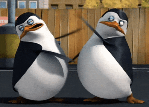 Two Penguins Are Standing Next To Each Other And One Has A Sword In Its Beak GIF