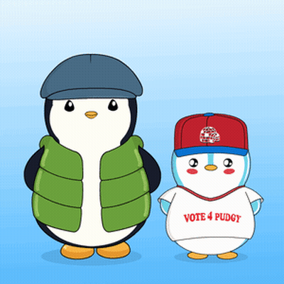 Two Penguins Are Standing Next To Each Other And One Is Wearing A Vote 4 Puddy Shirt GIF