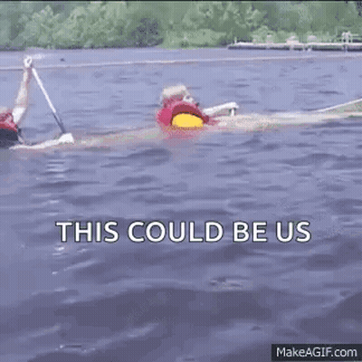 Two People Are Rowing Kayaks In The Water And The Words `` This Could Be Us '' Are Visible . GIF
