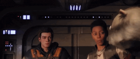 Two People Are Standing Next To Each Other In A Dark Room . GIF