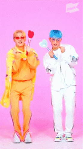 Two People Holding Hearts On Pink Background GIF