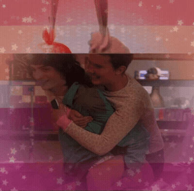 Two People Hugging On Pink Background GIF