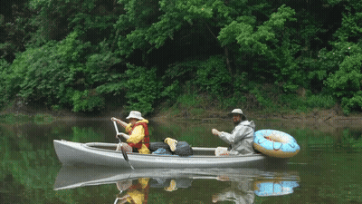 Two People In A Canoe That Says Kayak.com GIF