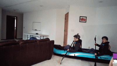 Two People In Tobin Inflatable Kayak In Living Room GIF