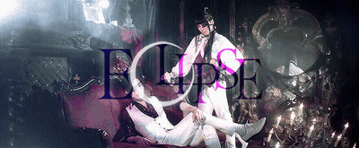 Two People Laying On A Red Couch With The Word Eclipse Written Above Them GIF