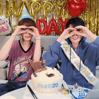 Two People Making Heart Hands In Front Of Happy Birthday Cake GIF