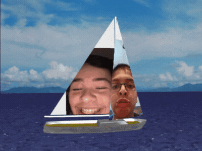 Two People On Sailboat In Ocean With Mountains GIF
