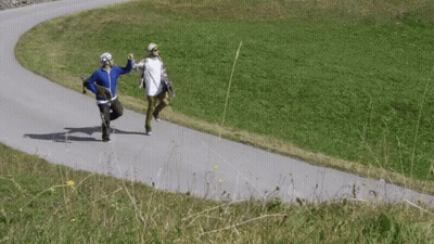 Two People Running On Road GIF