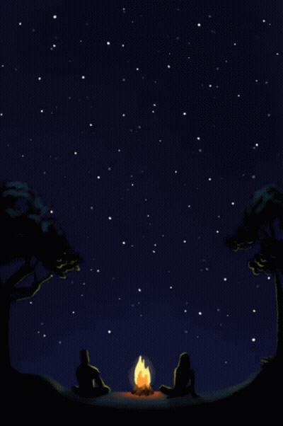Two People Sit Around A Campfire Under A Starry Sky GIF