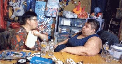 Two People Sitting At Be The Eye Of The Beholder Sign GIF